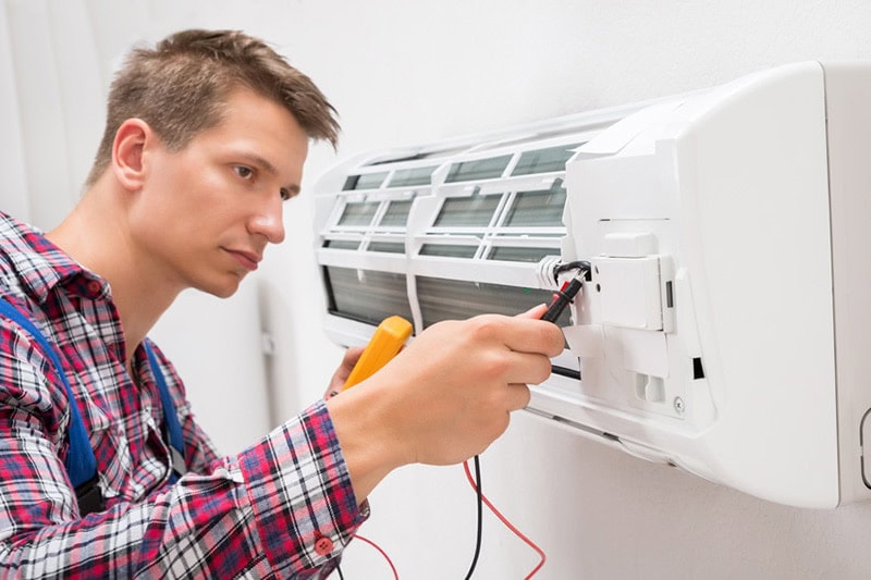 man working on a ductless system